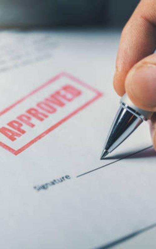 hand sign approved business contract closeup